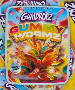 Gumdropz Gummy Wormz hybrid cannabis flower by Sprinklez, featuring dense green buds with orange pistils, fruity candy aroma, and vibrant packaging inspired by classic gummy worms